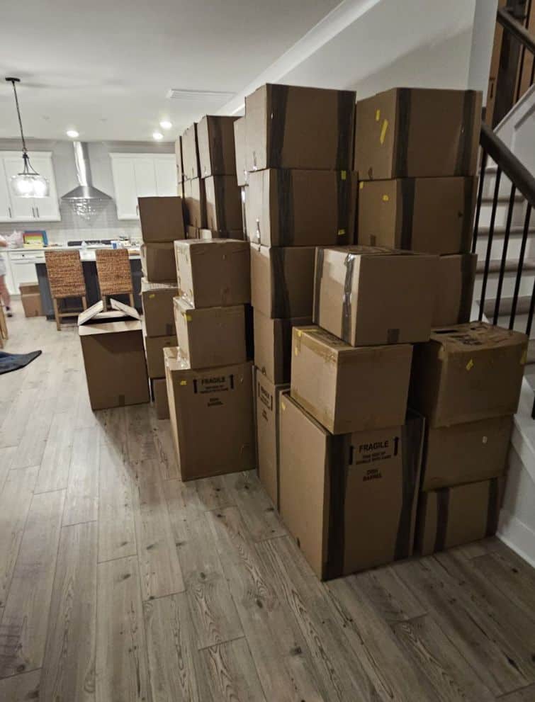 Moving boxes stacked in a home interior for US relocation.