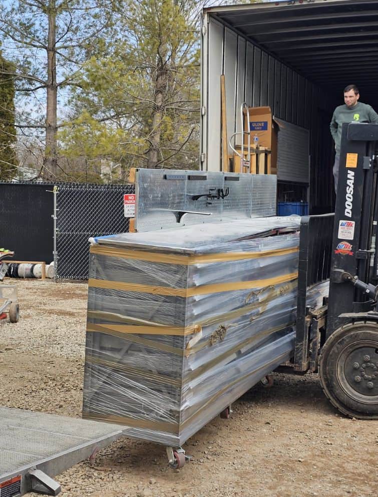Moving equipment being loaded onto a truck for US moving services.
