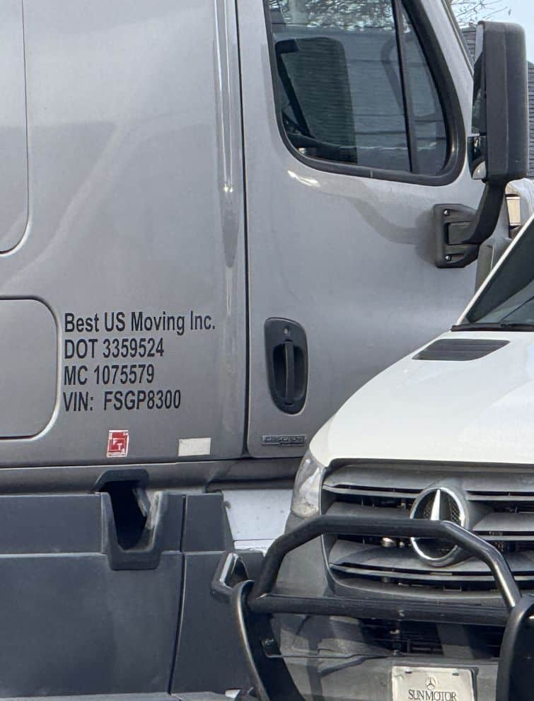 US Moving truck with company details visible on the side.