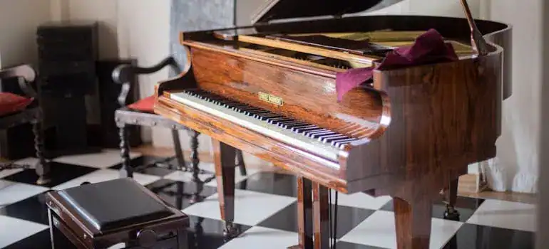 Beautiful wooden grand piano in a modern music room setting.