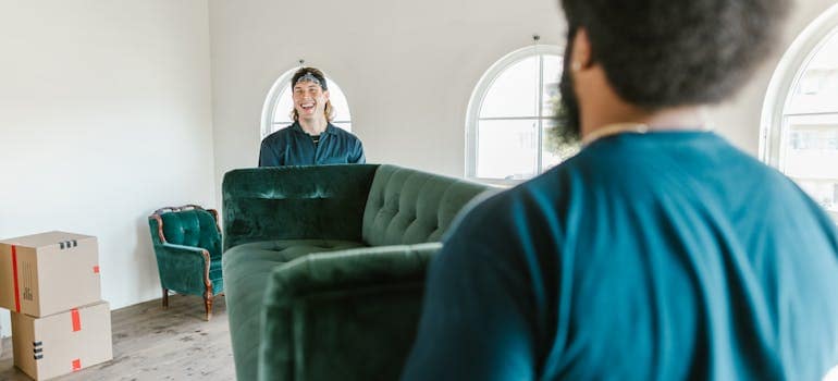 Customer consultation for US moving services in a bright, modern living room.